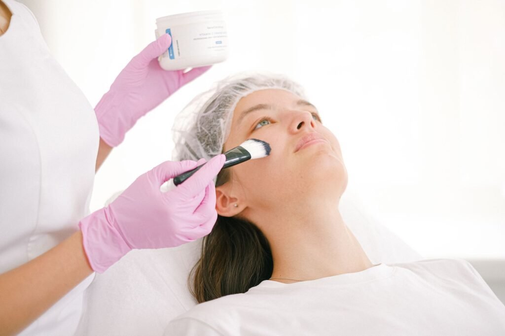 Client receiving a facial treatment from a skincare professional