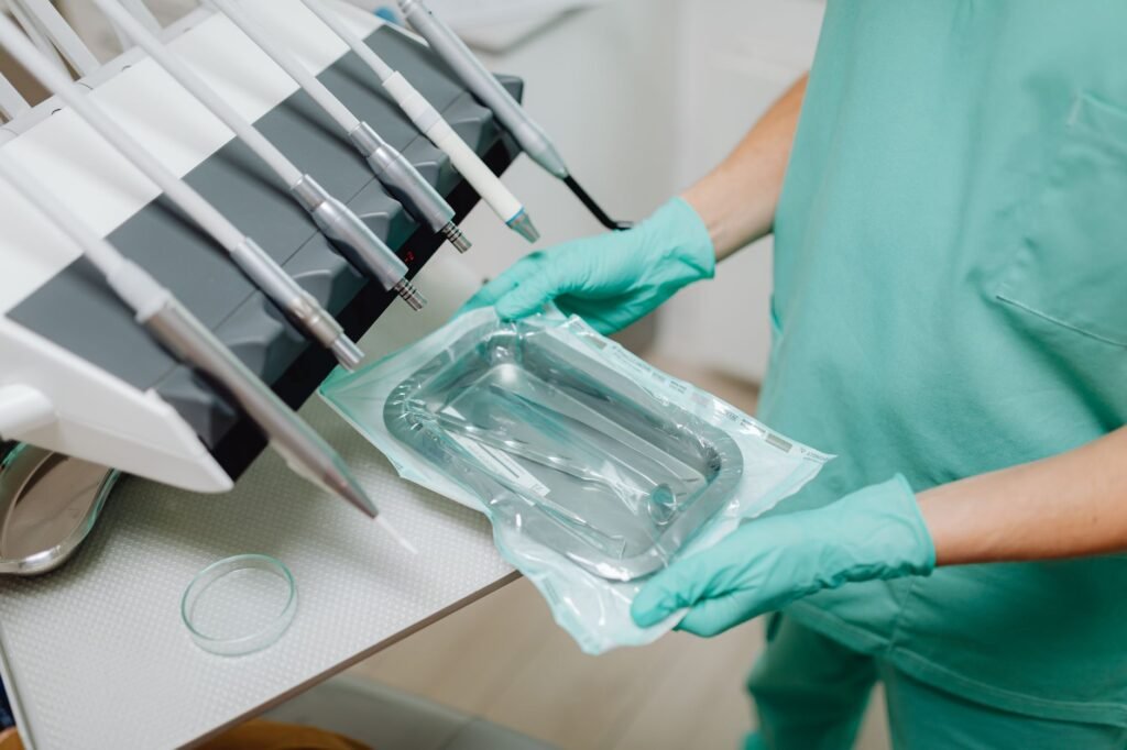 Medical provider preparing materials for a PRP microneedling treatment.